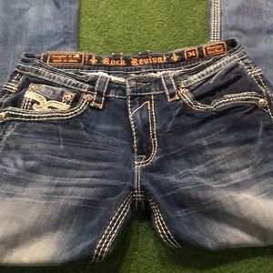 Men’s Distressed Rock Revival Jeans.